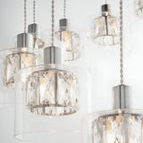 Marguerite 12-light pendant in polished chrome with faceted crystal shades on braided cables, shown close-up against a white background.