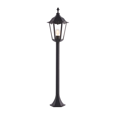Endon Ashshaw traditional bollard light in matt black die cast aluminium with clear glass lantern panels and filament E27 bulb, shown on white.