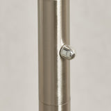 Close-up of the Endon Brockcombe floor lamp's satin nickel stem showing the central chrome rotary dimmer knob against a light background.