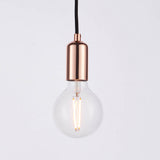 Endon Marlowe pendant light with a copper-plated E27 lamp holder on black fabric flex, shown with a clear globe filament bulb against a white background.