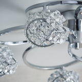 Close-up of Endon Seraphine semi-flush ceiling light showing a crystal-encrusted globe shade on a polished chrome curved arm.