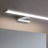 Endon Aldshaw LED bathroom wall light in chrome with a slim frosted diffuser bar, mounted above a mirror on a neutral wall.