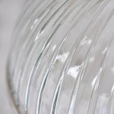 Close-up of the Wentworth Pendant Light's ribbed clear glass shade with nickel metal rim, showing vertical fluted texture and industrial-style detailing.