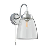 Endon Aldhurst chrome bathroom wall light with curved arm, clear glass bell shade, E14 filament bulb and pull cord switch on a plain background.