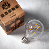 E27 LED filament globe bulb with clear glass and visible amber filaments, shown beside its Endon packaging on a light background.