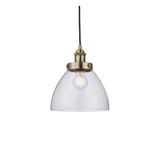 Endon Wentworth small industrial pendant light with clear glass dome shade, knurled antique brass lamp holder and black flex, on a white background.