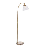 Endon Wentworth floor lamp in brass with an arched stem, adjustable knuckle, clear glass dome shade and round base, shown on a white background.