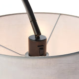 Close-up of the Endon Bevbourne floor lamp's matt black lamp holder with rocker switch, tilting arm, and light grey fabric shade interior.