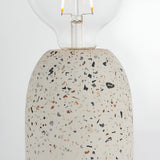 Endon Crangrove table lamp close-up showing the white terrazzo base with multicoloured aggregate flecks and exposed E27 filament globe bulb.