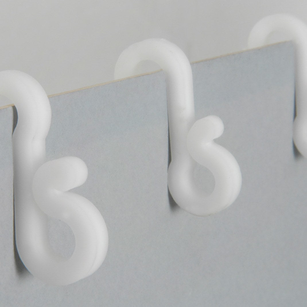 Close-up of LYYT Gutter Hooks from AVSL, white UV-resistant plastic clips shown fitted over the lip of a light grey gutter edge.