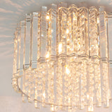 Close-up of the Brenbourne flush ceiling light showing tiered clear crystal rods and faceted glass droplets on a polished chrome frame, illuminated.