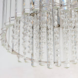 Close-up of the Brenbourne flush ceiling light showing tiered clear crystal droplets on a polished chrome frame, against a plain white background.