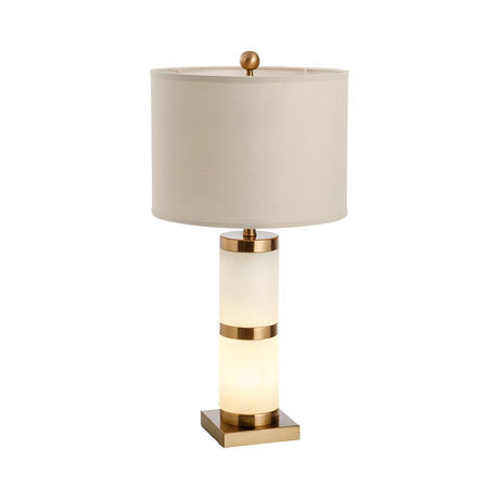 The Aurelin 1 Light Column Alabaster Table Lamp features a cylindrical alabaster and brass base with a soft white round fabric shade, finished with an elegant gold finial.