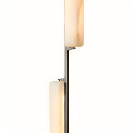 The Selvara LED Vertical Duo Alabaster Single Pendant Light features two softly glowing Spanish alabaster glass shades arranged vertically on a matte black support, adding modern elegance against a plain white background.