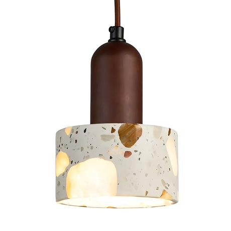 The Terroso 1 Light Drum Travertine Pendant Light in walnut brown and light beige features a modern design with a cylindrical upper section and terrazzo-patterned shade, suspended from a matching brown cord.