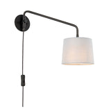 Endon Bevbourne plug-in wall light with matt black swing arm, light grey fabric shade, and in-line switch on black flex, on a white background.