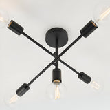 Endon Marlowe 5 light semi-flush ceiling light in black, with crossed metal arms and exposed E27 globe bulbs, viewed from below against a white ceiling.