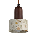 The Terroso 1 Light Drum Travertine Single Pendant Light in Walnut Brown & Light Beige features a walnut brown cylindrical top and a wide, terrazzo-style shade with stone-like patterns—an elegant modern pendant for any space.