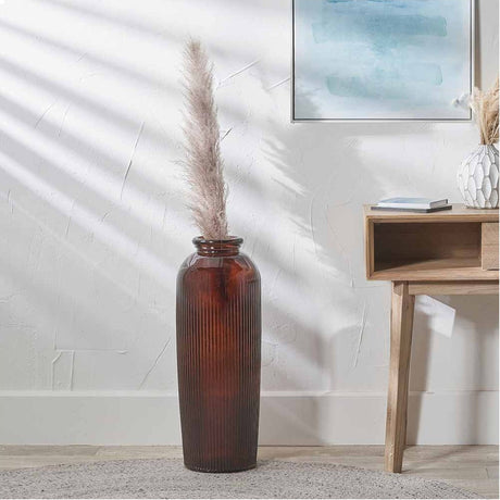 Pecan Brown Recycled Glass Ribbed Vase - 26cm, tall floor vase with pampas grass, styled beside a wooden console table in a living room.