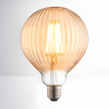 4W E27 LED filament bulb with ribbed amber glass globe and visible warm white filament, E27 screw cap base, on a plain light background.