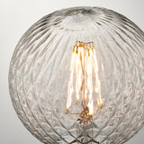 Endon 4W E27 LED filament faceted globe bulb in clear glass with visible warm white filament, shown close-up against a light background.
