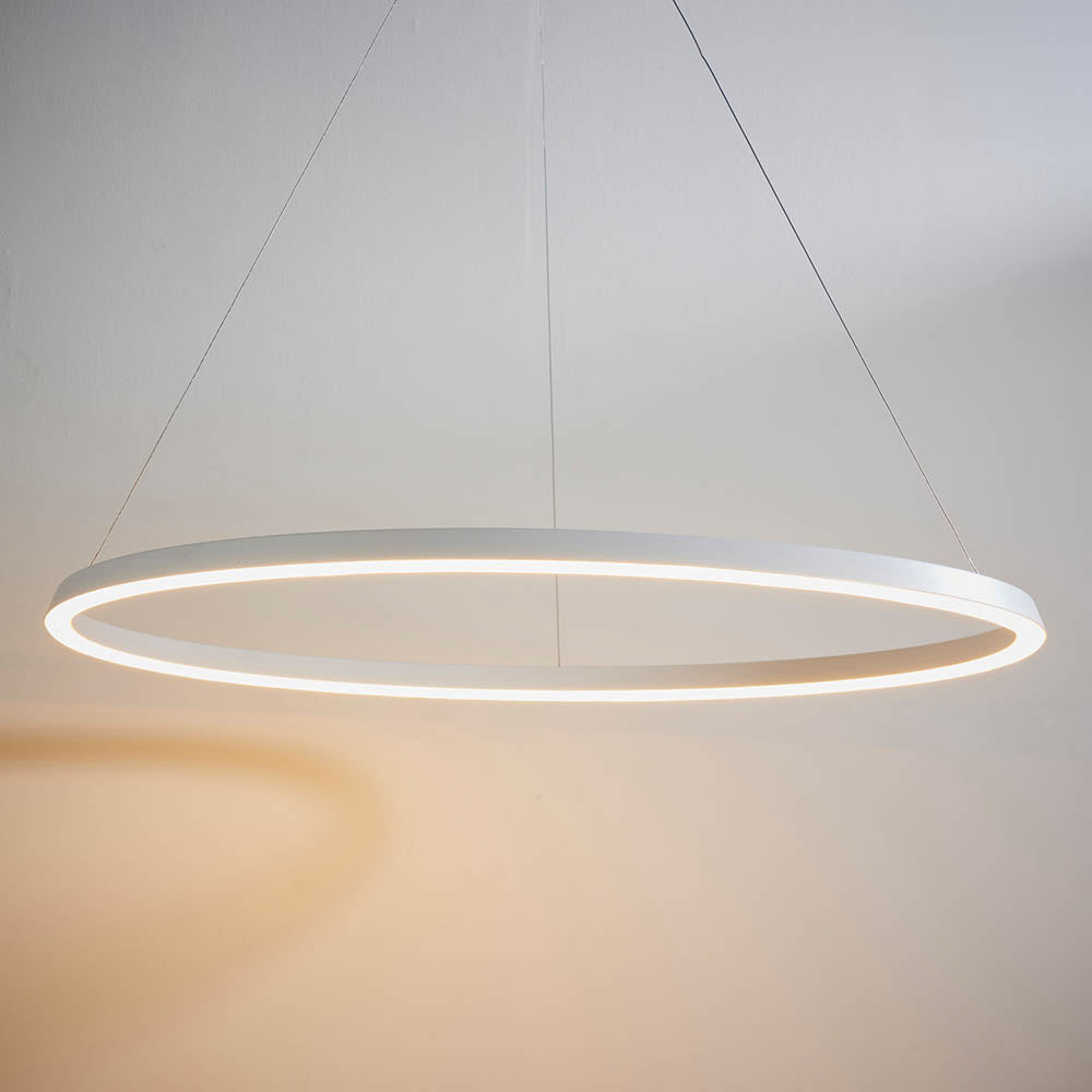 Endon Cliffton LED pendant in white, a slim 800mm ring suspended on fine wire cables with an illuminated diffuser, shown against a pale wall.