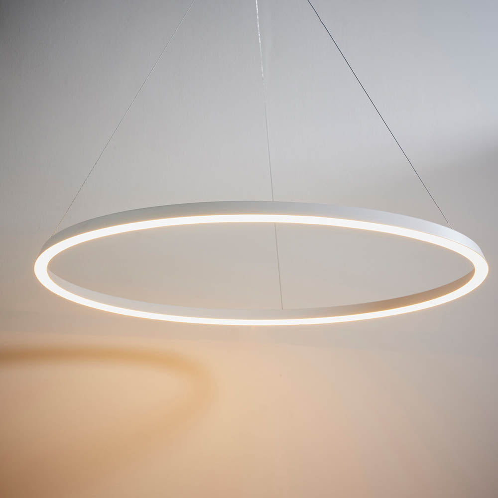 Endon Cliffton LED pendant in matt white, a slim large-diameter ring with illuminated diffuser suspended on fine cables against a pale wall.