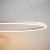 Endon Cliffton LED pendant in white, close view of the slim circular ring fitting suspended from fine wire cables with a lit diffuser edge.