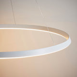 Close-up of the Endon Cliffton LED pendant in matt white, showing its slim circular profile and diffuser suspended on fine wire cables.