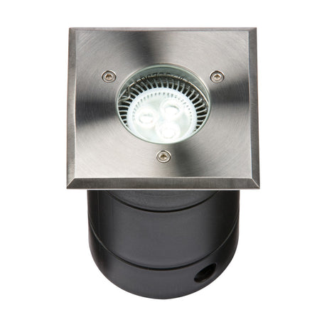 The Outdoor Square Drive Over Ground Light Stainless Steel features a sleek square design with a stylish metal finish and three visible LED bulbs. Designed for flush mounting, this IP67-rated ground light is constructed with a black cylindrical housing for durability and aesthetic appeal in any landscape.