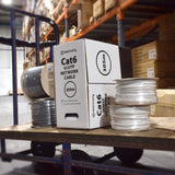 Mercury Cat6 U/UTP 305m network cable box in grey and white beside grey and white cable reels on a warehouse trolley.