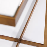 Close-up of the Tablo bronze console table, showing the metal frame's X-shaped crossing legs and fine edge detail against a mirrored glass top on a plain white background.