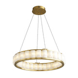 The Orion 36 Light Ring Alabaster Chandelier in soft white and brushed brass features a modern design with a gold frame, four thin cables, and evenly spaced alabaster panels that diffuse light elegantly around the circular fixture.