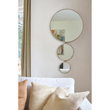 Opera Three Circle Gold Rimmed Wall Mirror, 119cm, three joined round mirrors decreasing in size with a slim gold frame, shown above a sofa with cushions.