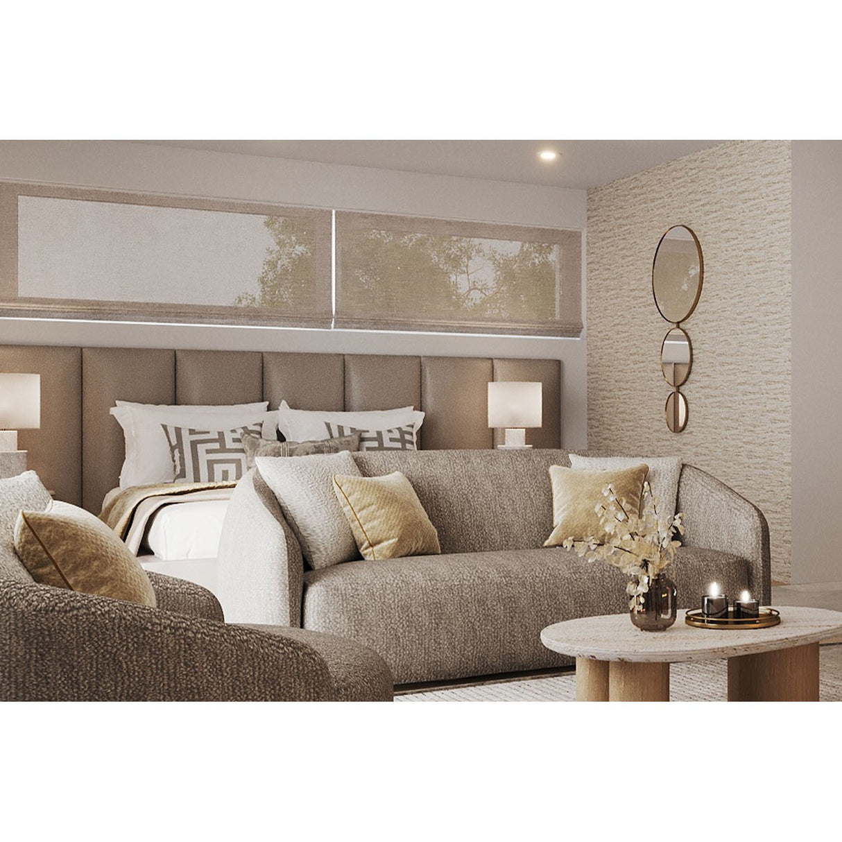 Opera Three Circle Gold Rimmed Wall Mirror, 119cm, three joined circular mirrors decreasing in size with gold rims, shown mounted on a textured wall beside a bed and sofa.