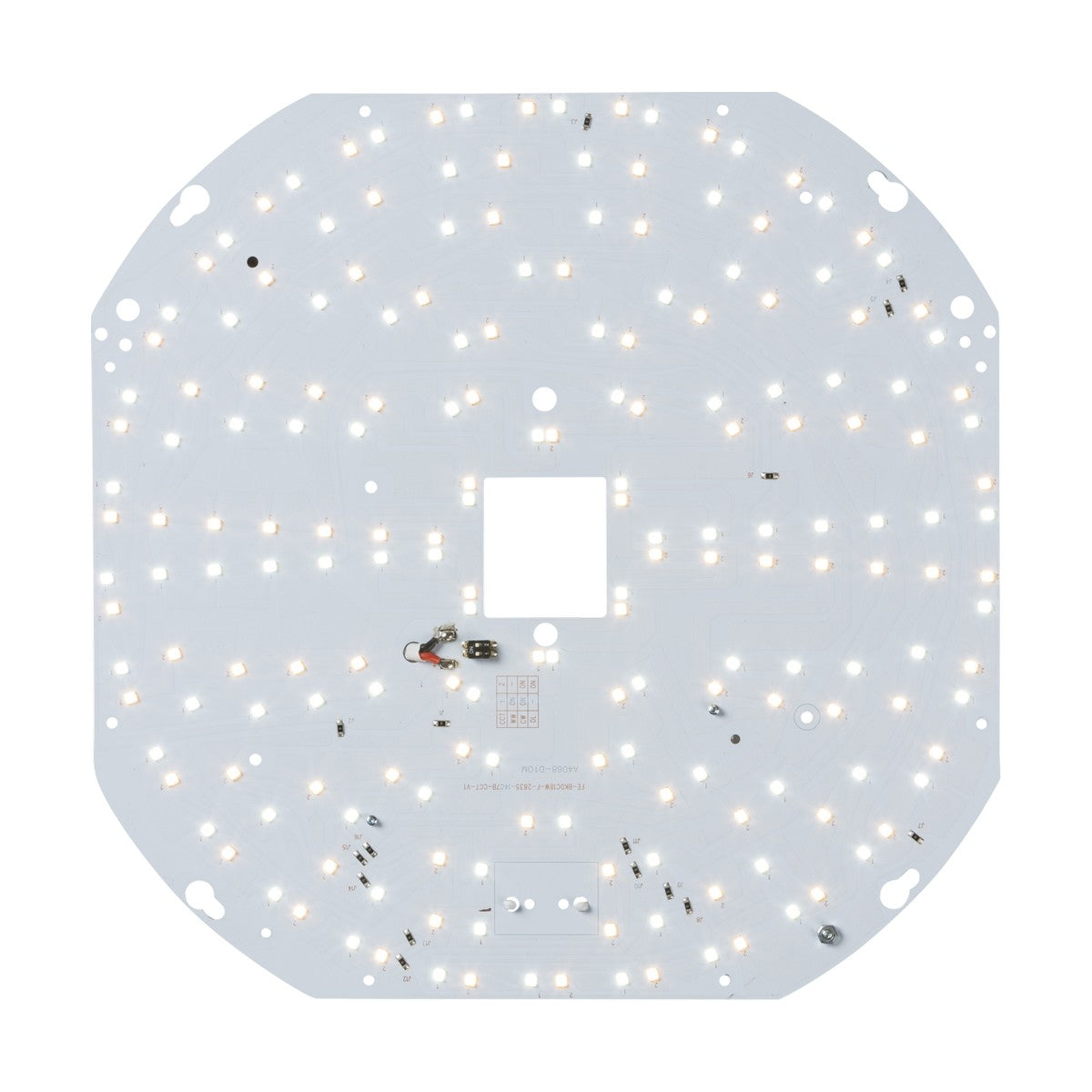 The 18W CCT LED Gear Tray showcases a circuit board with numerous small LEDs arranged in concentric circles, featuring a central square cutout and various attached electronic components for adjustable CCT functionality, all set against a white background.