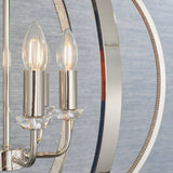 Close-up of the Cliffbury 6 Light Pendant in nickel with candle-style bulbs on crystal-detailed holders and a round open frame with faceted trim.