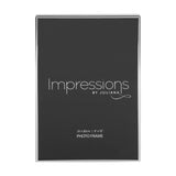 Thin oblong silverplated metal photo frame with a narrow rectangular border, holding a 12 x 8in print, shown on a plain white background.