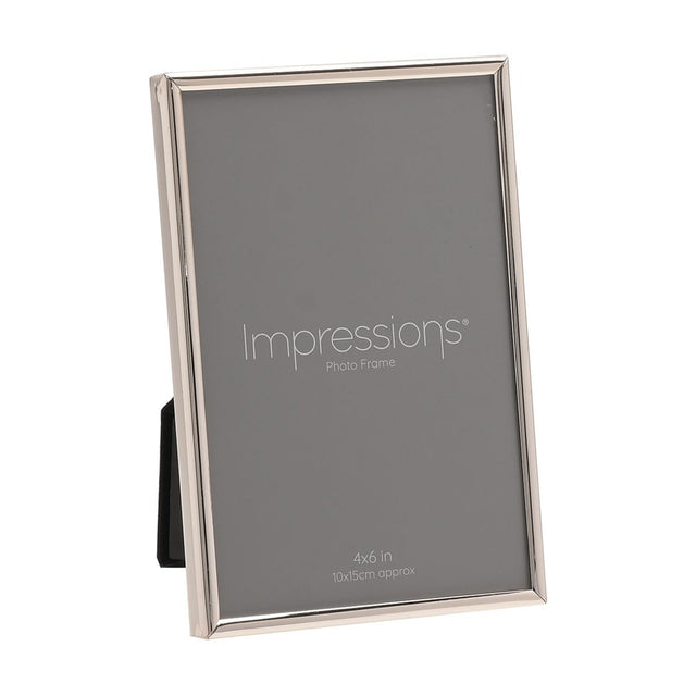 Thin oblong photo frame in silver-plated metal with slim rounded edge, holding a 4x6in print, shown upright on a plain white background.