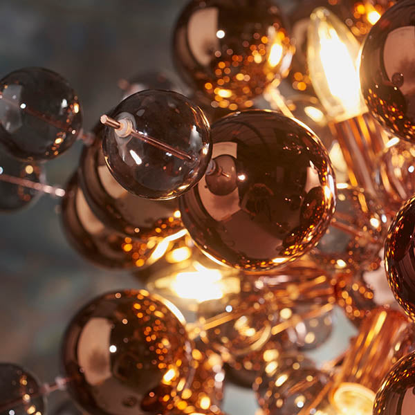 Close-up of Endon Brockford 9 Light Cluster Pendant in copper, showing clustered smoked mirror and tinted glass spheres on plated metalwork with lit E14 lamps.