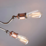 Brackley 8 Light Semi-Flush Ceiling Light with pewter arms, knurled copper-finish E27 lampholders, and exposed filament bulbs.