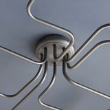 Close-up of the Brackley 8 Light Semi-Flush Ceiling Light in pewter, showing metal arms with E27 fittings meeting at a round ceiling plate.