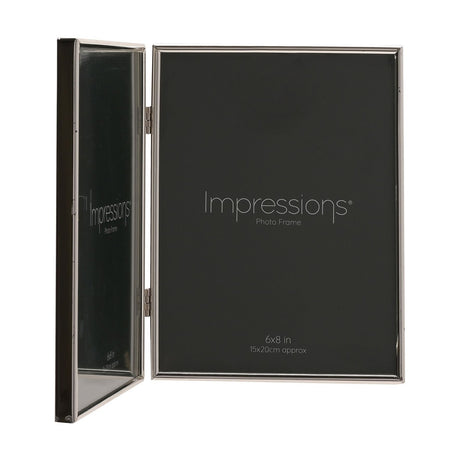 Hinged double photo frame in bright silverplated metal, two rectangular 8x6in portrait apertures joined by small hinges, shown open at an angle on a white background.