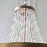 Bevdale 5 Light Pendant in gold, close-up of tiered clear glass beads cascading from a metal ceiling ring, shown against a plain light background.