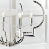 Close-up of the Bramfield 4-Light Pendant in polished nickel with candle bulbs, crystal glass bobeches, and angular metal arms.