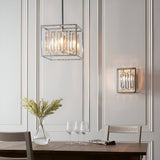 Endon Aldbourne 4 light square pendant in polished chrome with bevelled glass crystals, shown with matching wall light above a dining table.