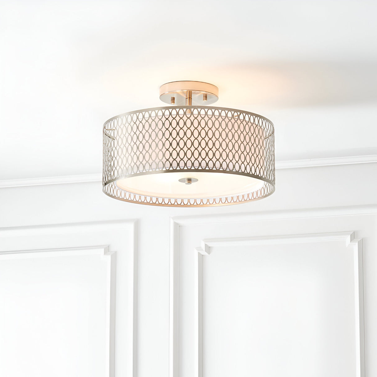 Endon Rosaline 3 light flush ceiling light in nickel with patterned circular drum shade and inner fabric diffuser, mounted on a white panelled ceiling.