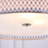 Close-up of the Endon Rosaline 3 Light Pendant showing the frosted glass diffuser, nickel centre fitting and geometric fretwork rim glowing softly above.