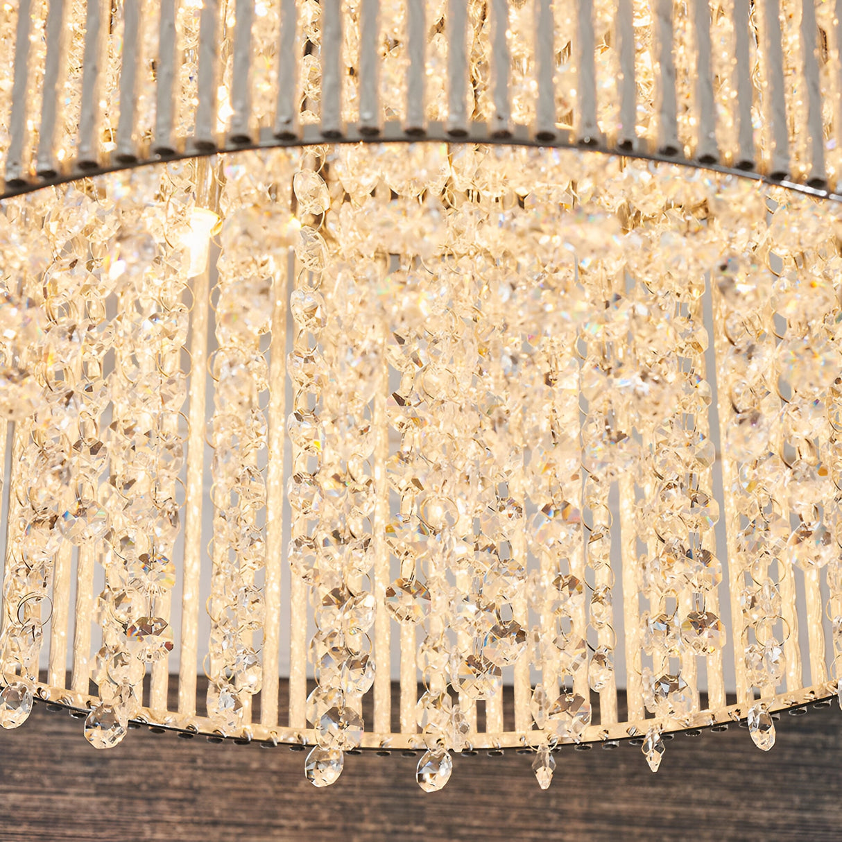 Close-up of the Isadora 10 Light Crystal Flush Ceiling Light in clear, showing clustered crystal strands and vertical rods around a chrome frame.