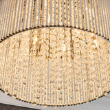 Close-up of the Isadora 10 Light Crystal Flush Ceiling Light in clear finish with cascading crystal strands and vertical rods lit by G9 lamps.